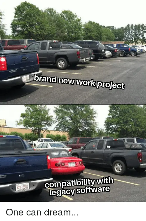 Picture of an empty car spot between two parked trucks labelled 'brand new work project', then a second picture showing there is a mini parked there after all labelled with 'compatibility with legacy software' followed by the line 'One can dream....'
